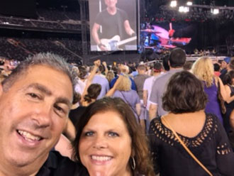 Kathy and her husband at a Bruce Springstein concert 10 days after her surgery