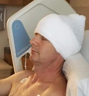 Peter Benson resting comfortably after his surgery to remove an acoustic neuroma