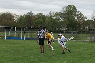 Cole playing lacrosse Cole playing lacrosse