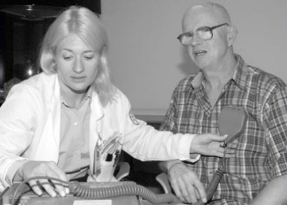 Kristin Strybing works with one of the first patients to be programmed for deep brain stimulation (about 2002)