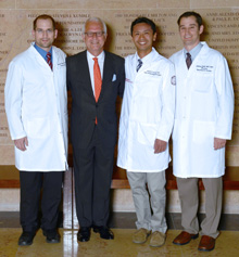 Department chairman Dr. Philip E. Stieg ,(left to right, in lab coats) Dr. Christoph Hofstetter, Dr. Lewis Leng, and Dr. William Cobb.