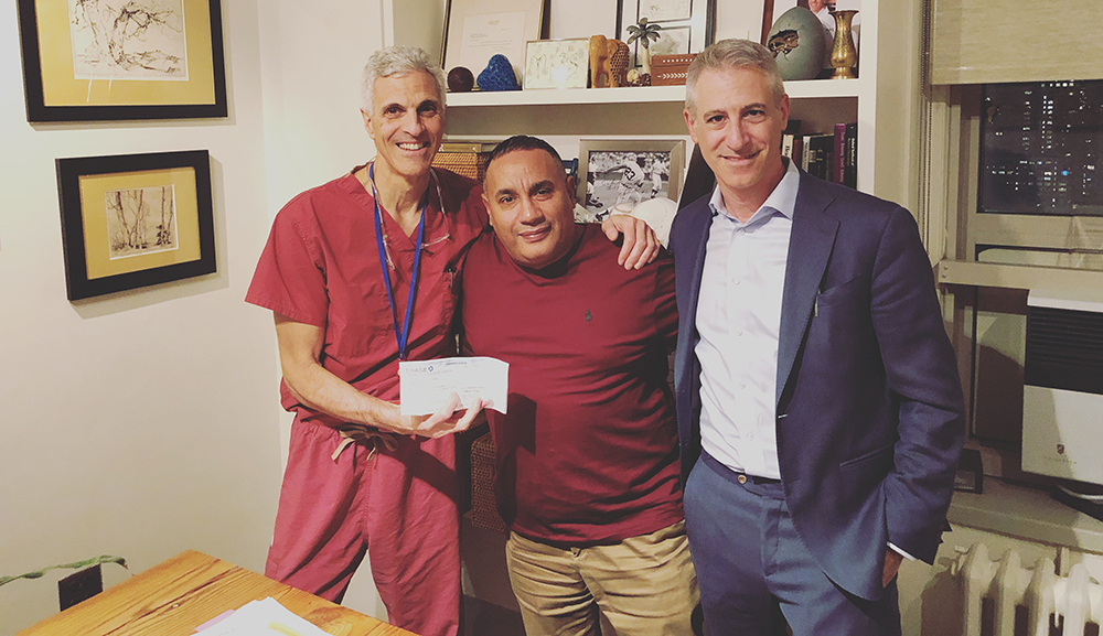 Above: Dr. Mark Souweidane, John Rivera, and Dr. Jeffrey Greenfield on Giving Tuesday 2021. Below, Cristian Rivera celebrates Halloween with his dad.