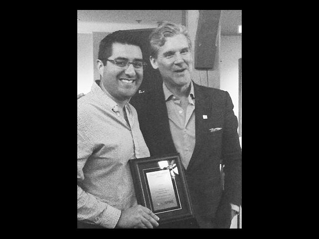 Dr. Rodrigo Navarro-Ramirez (left) receives the award for Best Basic Research Oral Presentation from Dr. Michael Fehlings, president of AO Spine North America