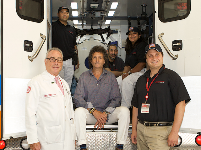 Alan Lichtenstein with neurologist-in-chief Matthew Fink, MD, and the mobile stroke unit team