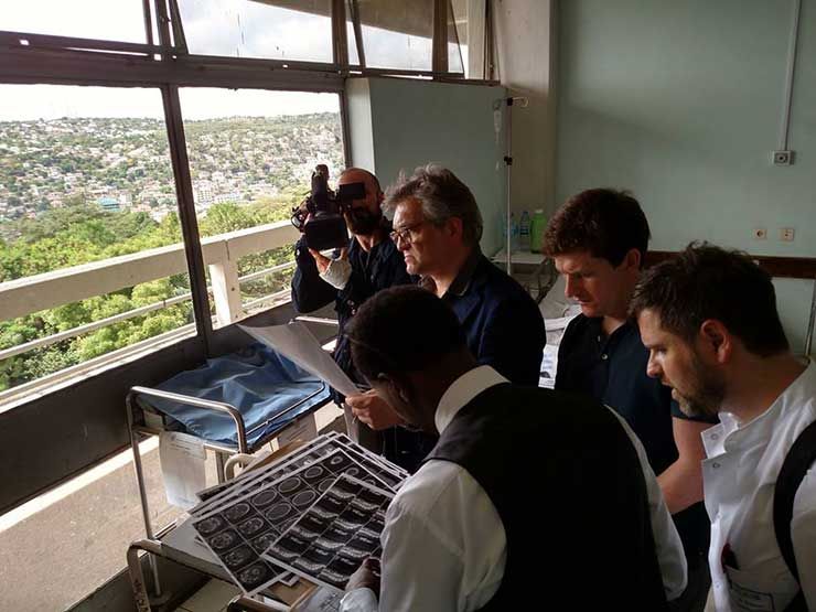 Dr. Hartl reviewing scans with the team in Tanzania