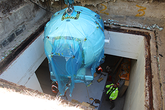 An access hatch, unused for nearly 30 years, was opened to allow the machine to be (gently) lowered into the subbasement. It was then maneuvered to its final destination in the Stitch Radiation Oncology Center. An access hatch, unused for nearly 30 years, was opened to allow the machine to be (gently) lowered into the subbasement. It was then maneuvered to its final destination in the Stitch Radiation Oncology Center.