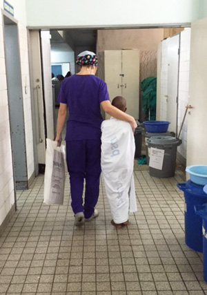 Dr. Maria Santos with a patient at Bugando Medical Centre in Mwanza, Tanzania